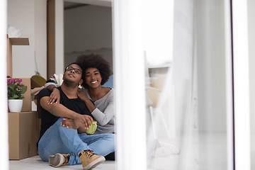 Image showing African American couple relaxing in new house