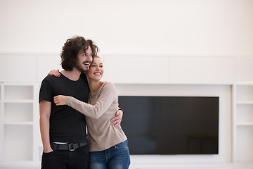 Image showing couple hugging in their new home