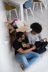 Image showing African American couple relaxing in new house