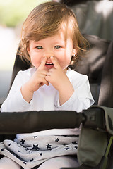 Image showing baby girl sitting in the pram