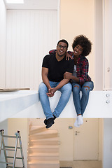 Image showing couple having break during moving to new house