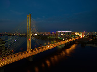 Image showing Automobile and railroad bridge in Kiev, the capital of Ukraine. Bridge at sunset across the Dnieper River. Kiev bridge against the backdrop of a beautiful sunset in Kiev. Bridge in evening sunshine