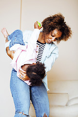 Image showing adorable sweet young afro-american mother with cute little daugh