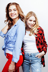 Image showing two pretty blond woman having fun together on white background, mature mother and young teenage daughter, lifestyle people concept