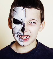 Image showing little cute boy with facepaint like skeleton to celebrate hallow