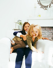 Image showing two cute sisters at home playing, little girl in house interior 