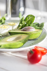 Image showing Wine, Tomatoes and greenery wooden background