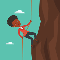 Image showing Business woman climbing on the mountain.