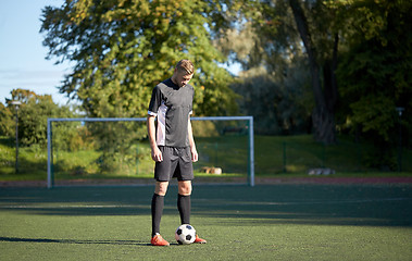 Image showing soccer player playing with ball on football field