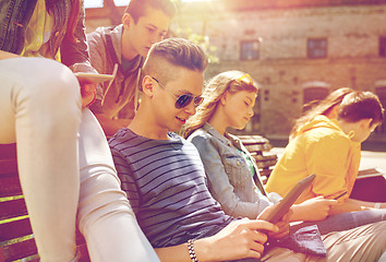 Image showing group of students with tablet pc at school yard