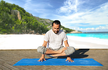 Image showing man making yoga in scale pose outdoors