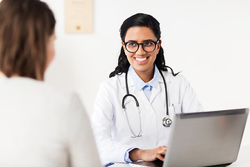 Image showing doctor with laptop and woman patient at hospital