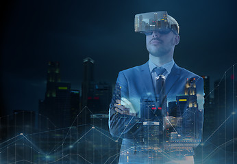 Image showing businessman in virtual reality headset over city