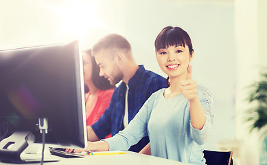 Image showing happy creative team or students working at office