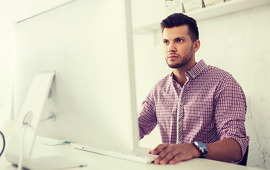 Image showing creative man or student with computer at office