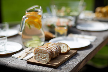 Image showing table with food for dinner at summer garden party