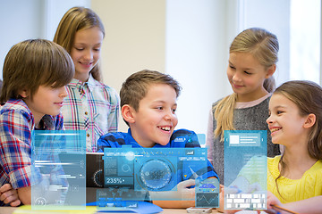 Image showing group of school kids with tablet pc in classroom