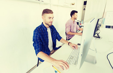 Image showing creative man or student with computer at office