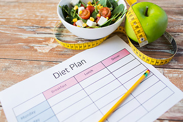 Image showing close up of diet plan and food on table