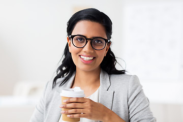 Image showing businesswoman with coffee in paper cup at office