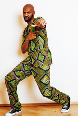 Image showing portrait of young handsome african man wearing bright green nati