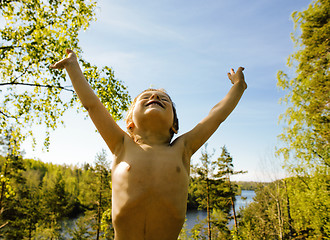 Image showing little cute real boy among tree hight, outdoor lifestyle people 