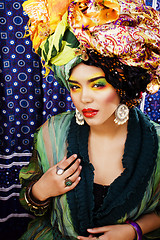 Image showing beauty bright woman with creative make up, many shawls on head l