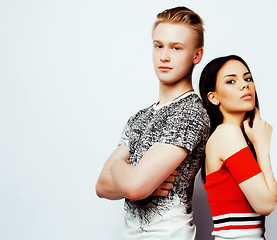 Image showing young pretty teenage couple, hipster guy with his girlfriend happy smiling and hugging isolated on white background, lifestyle people concept 