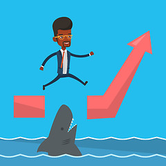 Image showing Businessman jumping over ocean with shark.