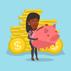 Image showing Business woman holding a big piggy bank.