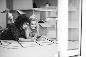 Image showing Young couple moving in a new flat