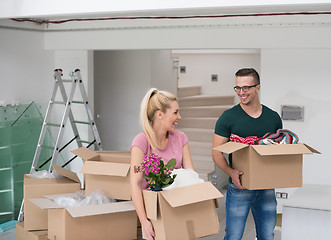 Image showing young couple moving into a new home