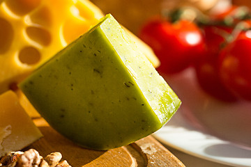 Image showing Wine, baguette and cheese on wooden background