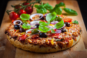 Image showing Traditional homemade pizza with tomatoes and olives