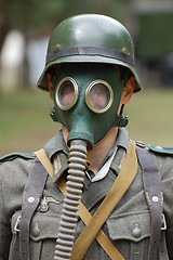 Image showing German soldier in gas mask. WW2 reenacting