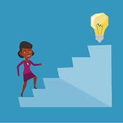 Image showing Business woman walking upstairs to the idea bulb.