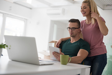 Image showing Young couple moving in a new home