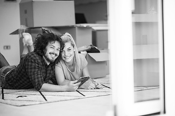 Image showing Young couple moving in a new flat