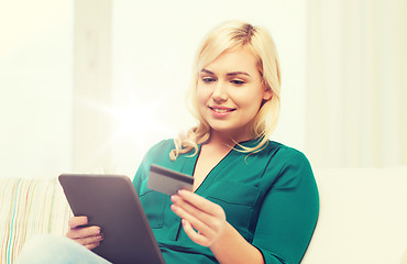 Image showing happy woman with tablet pc and credit card