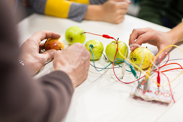 Image showing kids hands with invention kit at robotics school