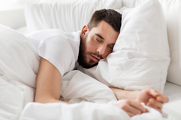 Image showing close up of man sleeping in bed at home