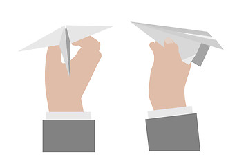 Image showing Hand holding a paper airplane.