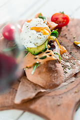 Image showing The baguette and cheese on wooden background