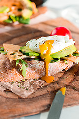 Image showing The baguette and cheese on wooden background