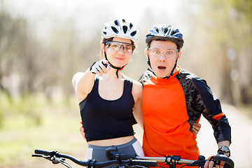 Image showing Young cyclists, focused on hand