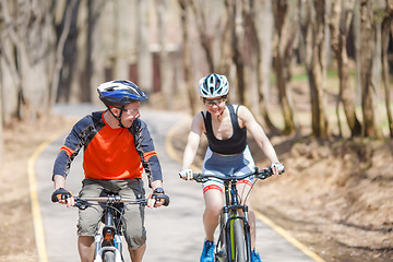 Image showing Athletes in helmets on bicycles