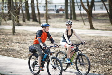 Image showing Photo of cyclists in woods