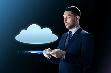 Image showing businessman with tablet pc and cloud projection