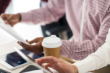 Image showing business team with papers and coffee at office