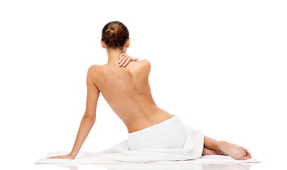 Image showing beautiful young woman in white towel with bare top